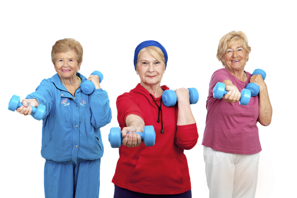 Three senior women doing workout.