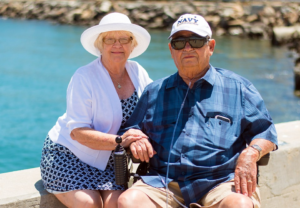 Miami couple on the board walk near the beach